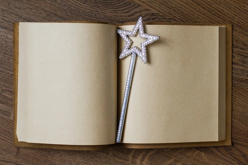 book with magic wand