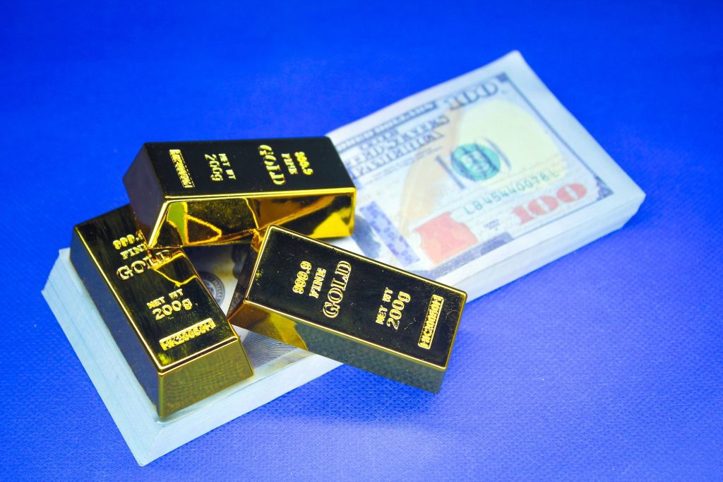 gold nuggets and paper money. asset concept