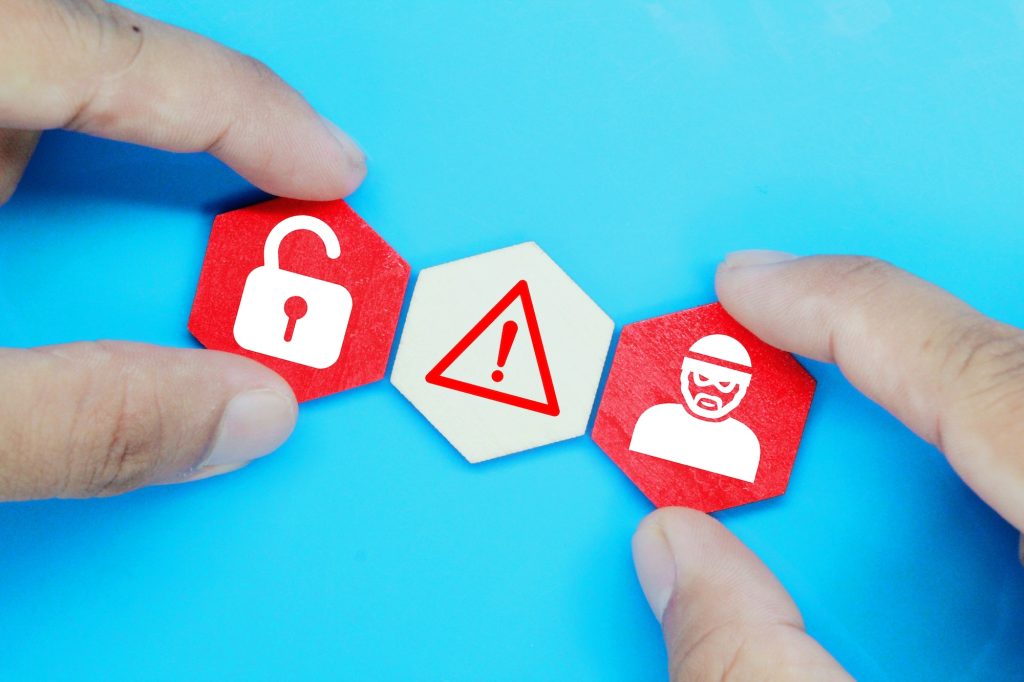 hexagon with cyber robber icons, caution and unlock. safety and security