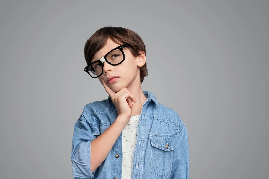 Smart boy thinking and looking up