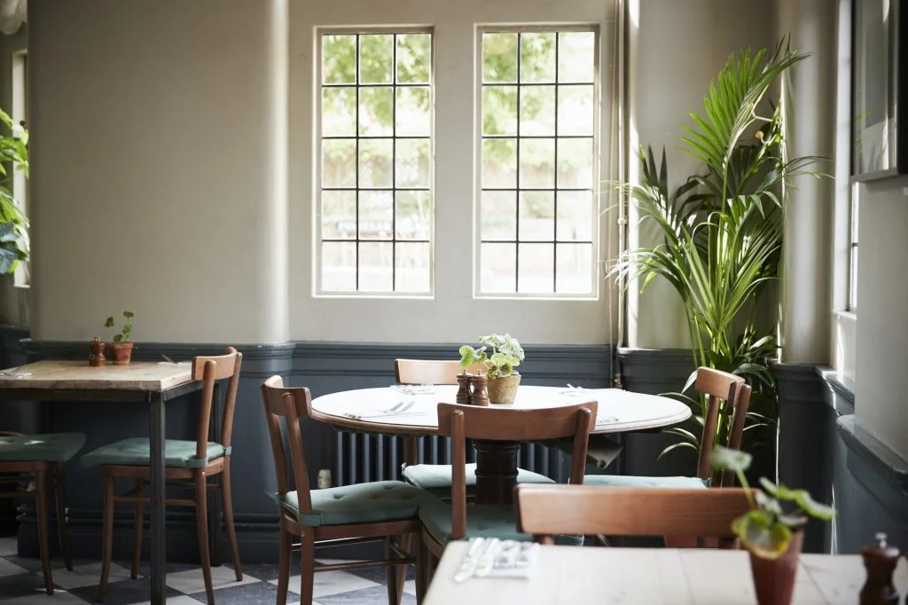 Tables Laid For Service In Empty Restaurant