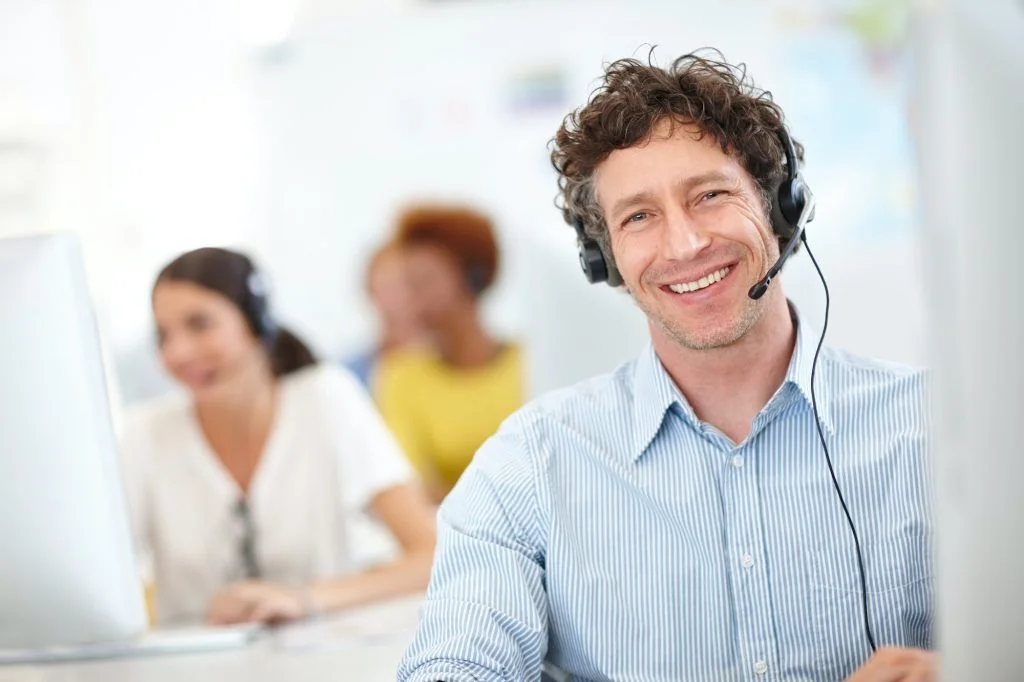 Were the call center you need. Cropped portrait of a handsome call center operator in the office.
