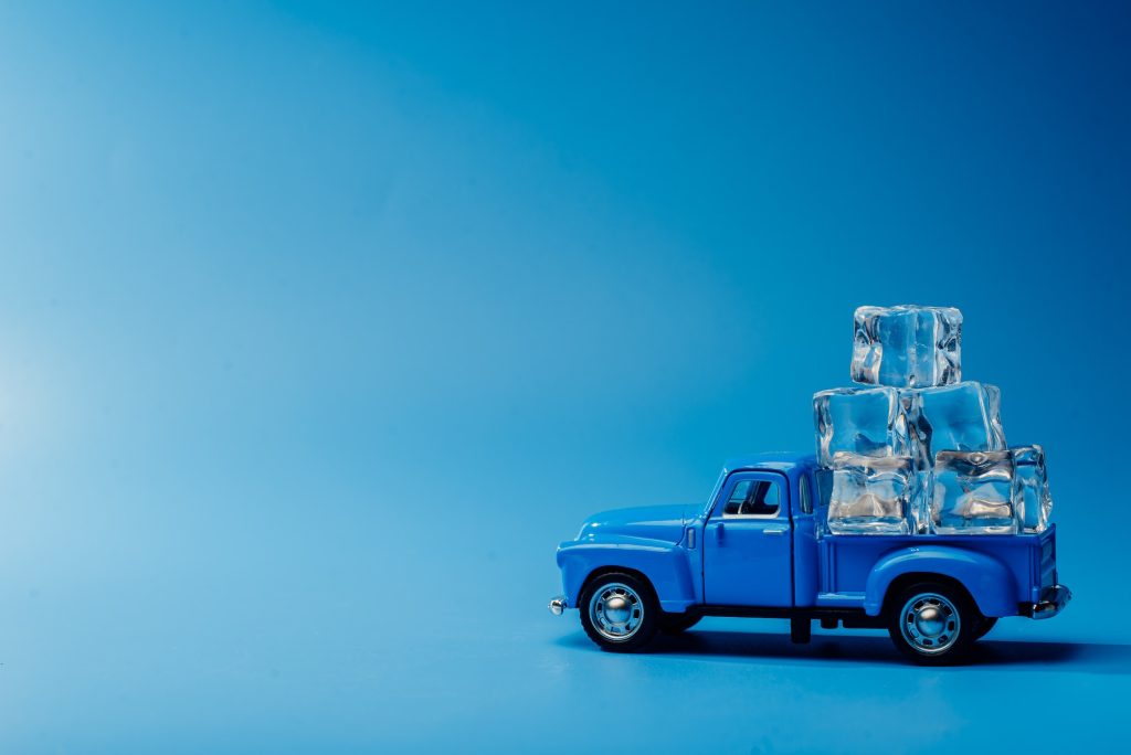 Toy blue car with ice. Minimalism Ice Machine