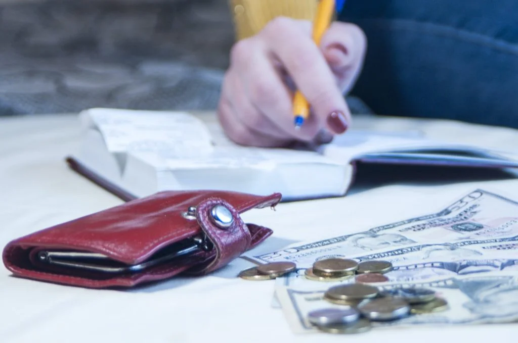 a business woman calculates the financial costs and revenues,