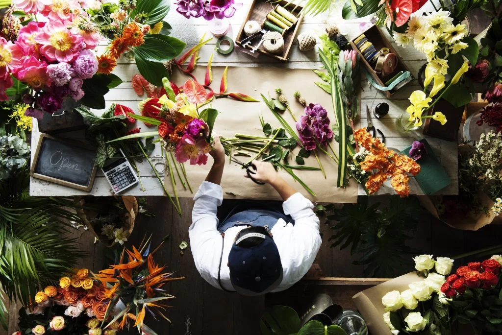 Flower shop business owner working service