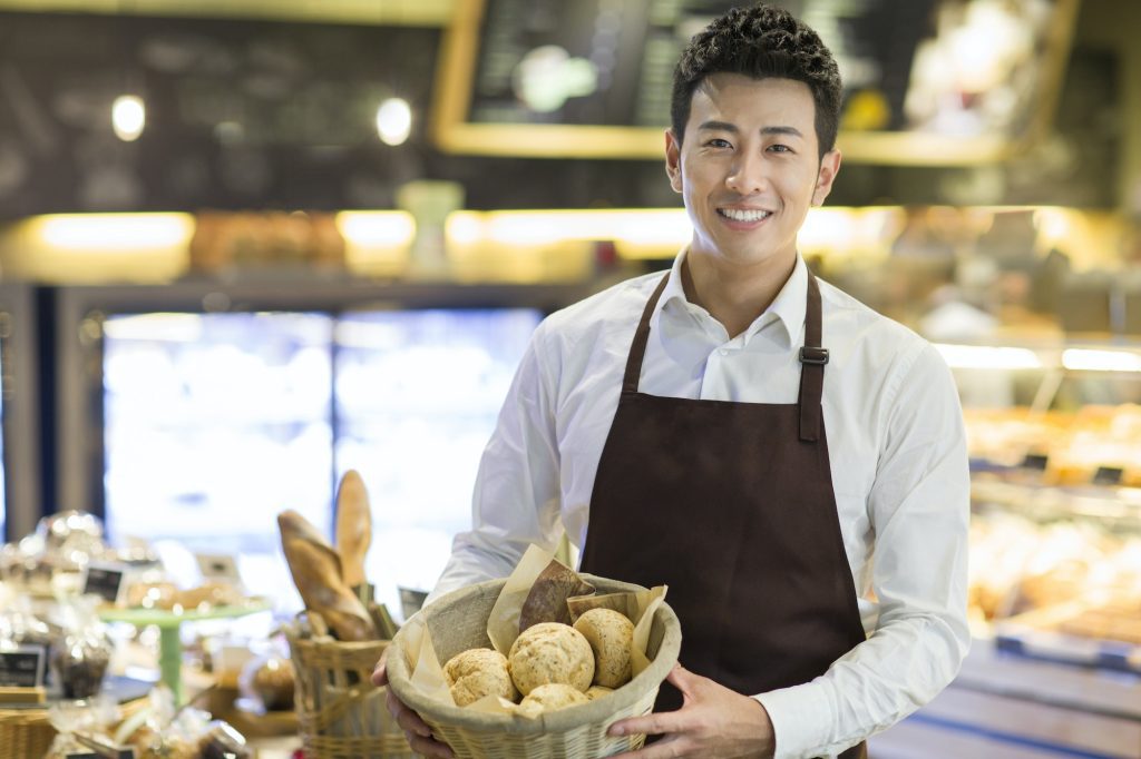 Young man working in bakery